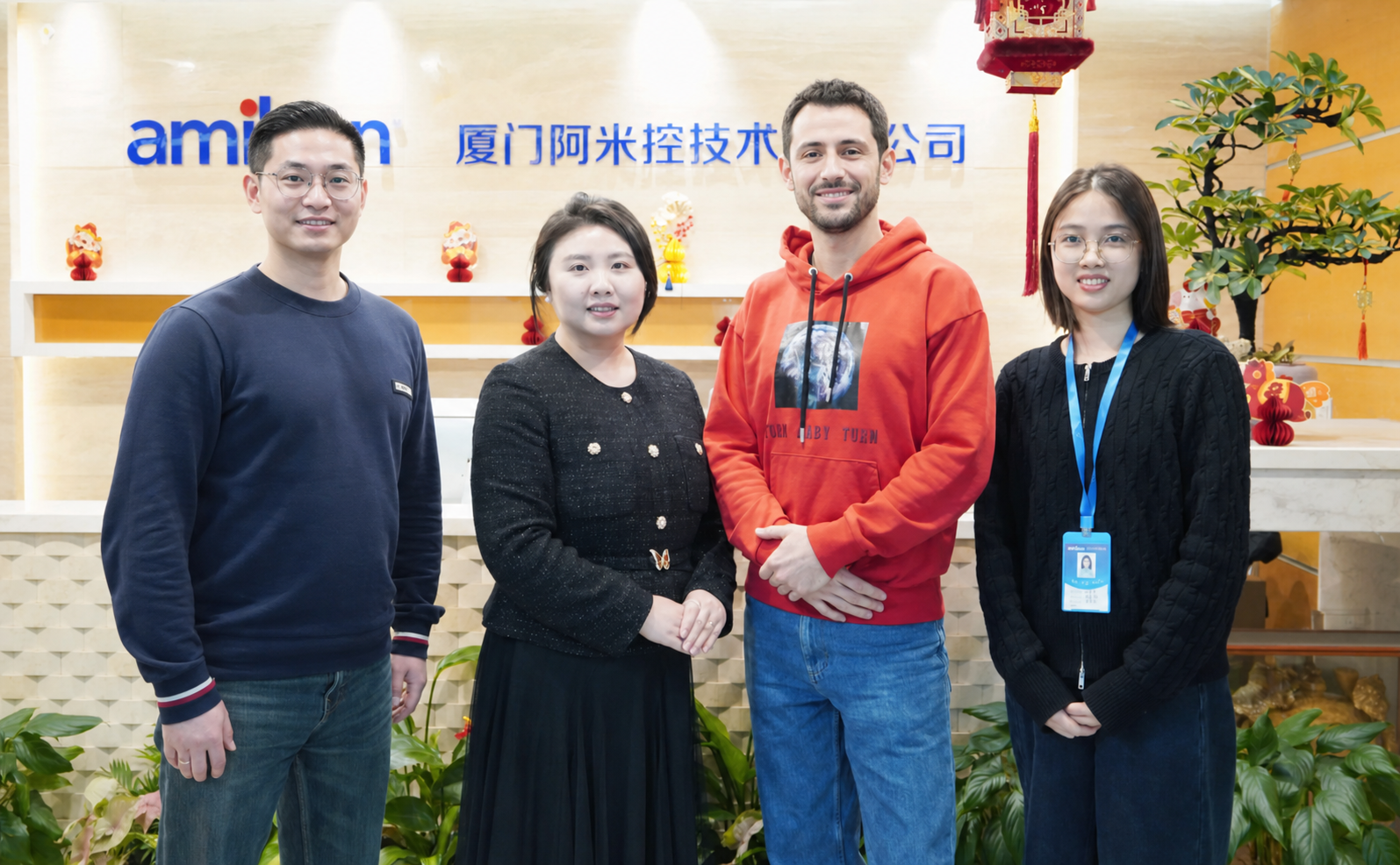 Two international customers visiting the Stockoems industrial automation team