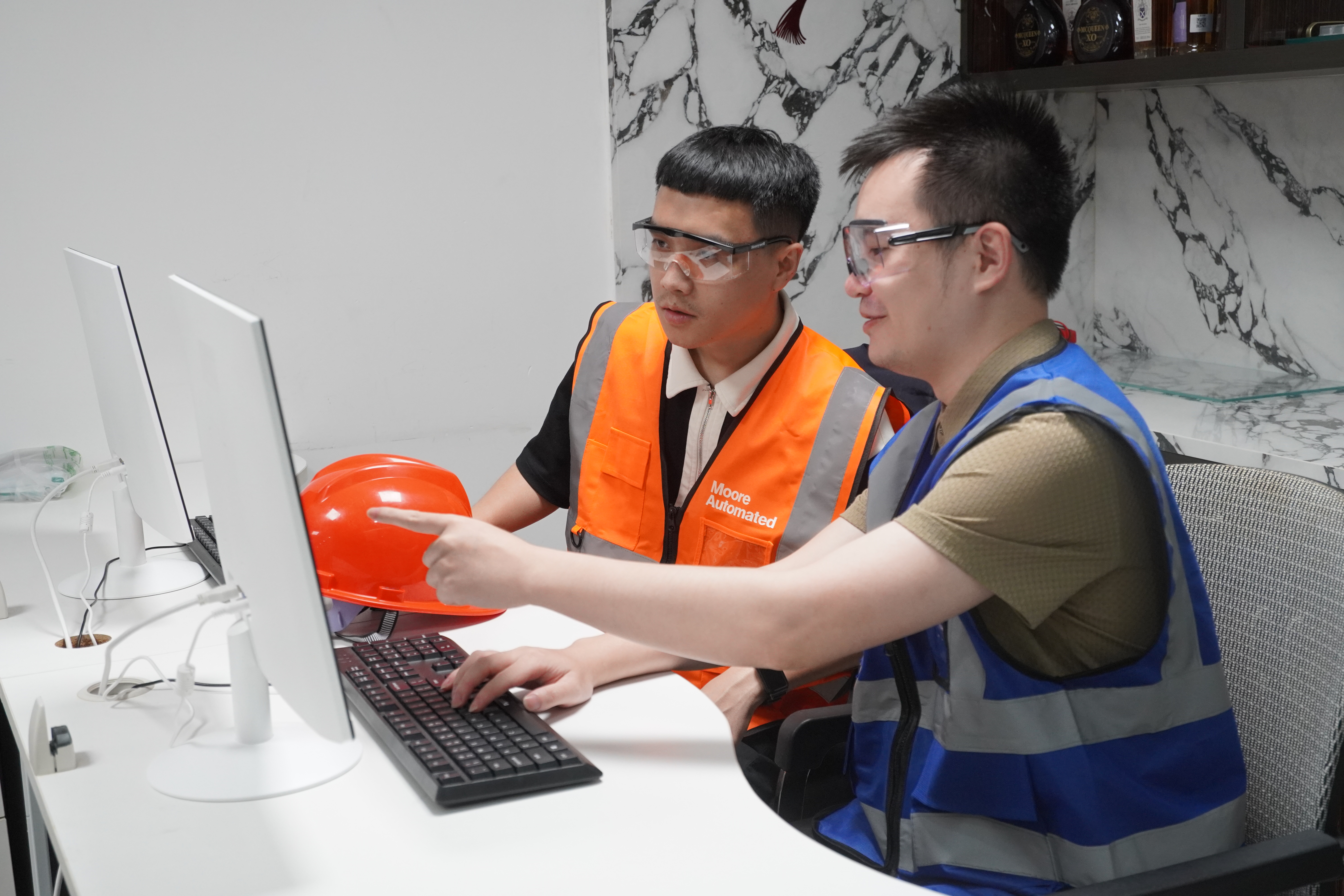 Stockoems technical team coordinating industrial automation order details