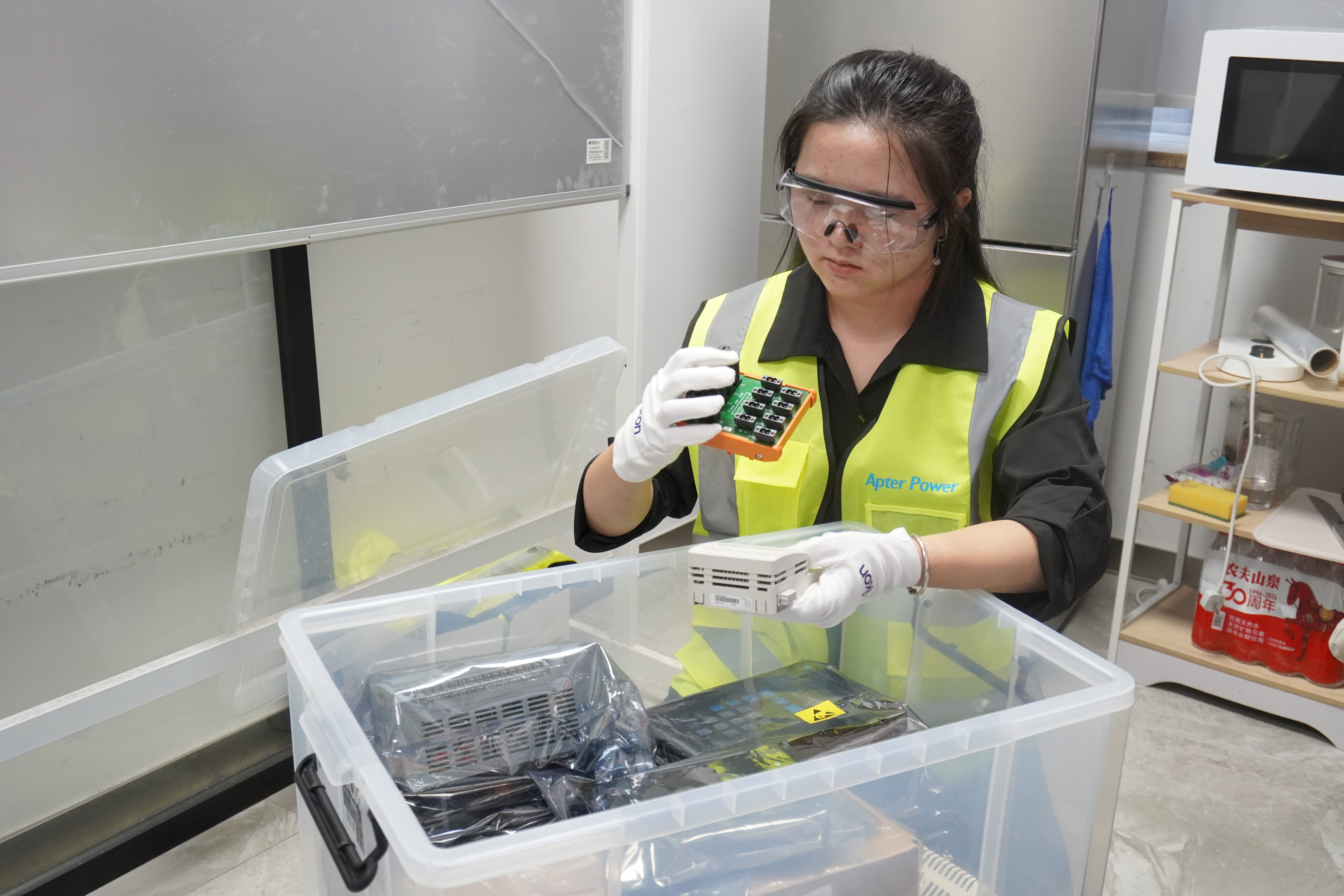 Technician checking automation modules during incoming quality inspection