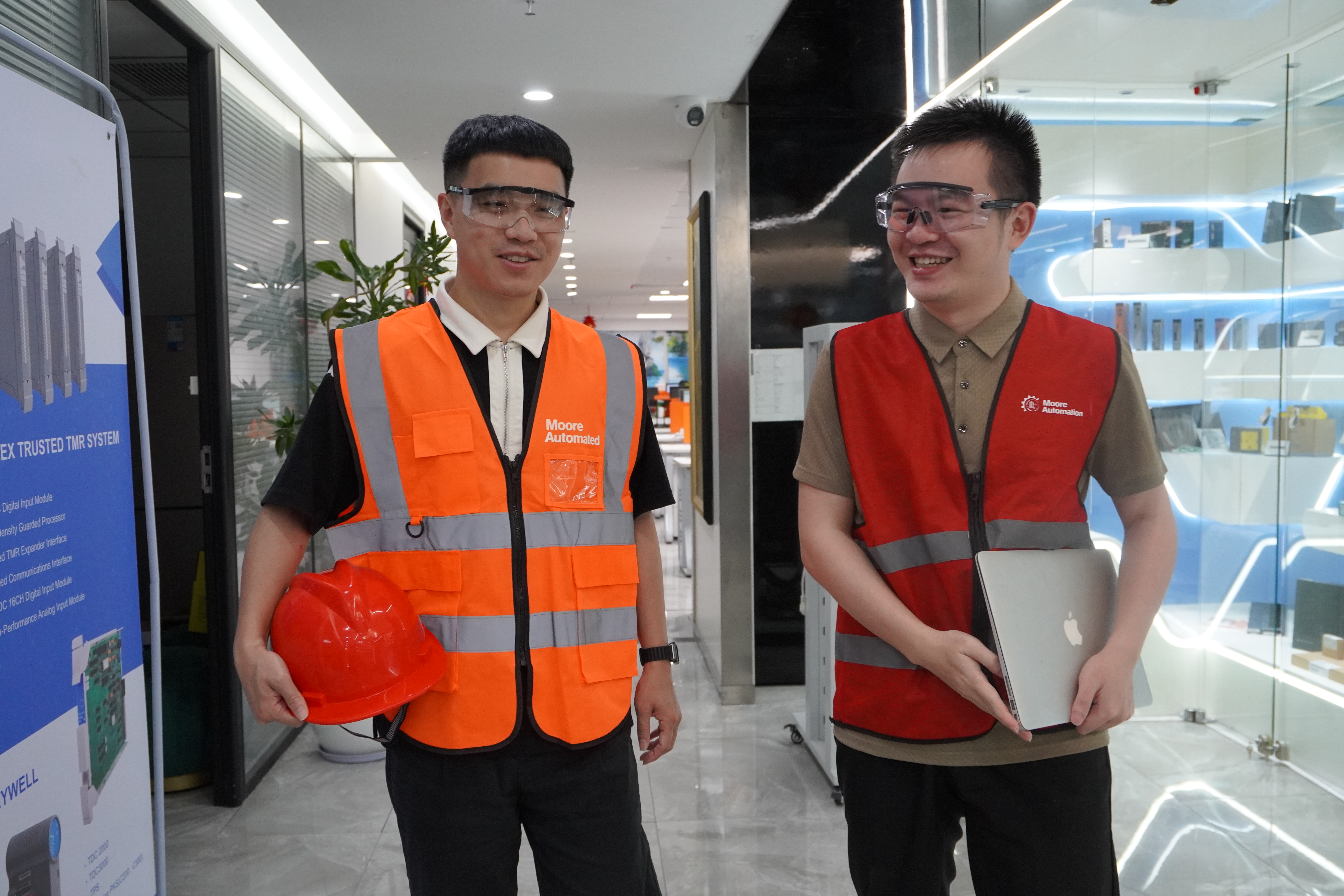 Office handover discussion between automation specialists