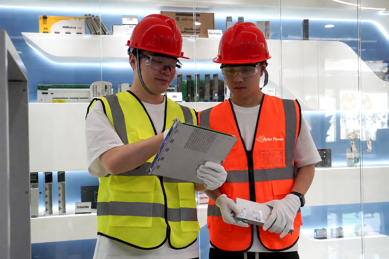 Technical staff reviewing an automation component in the office