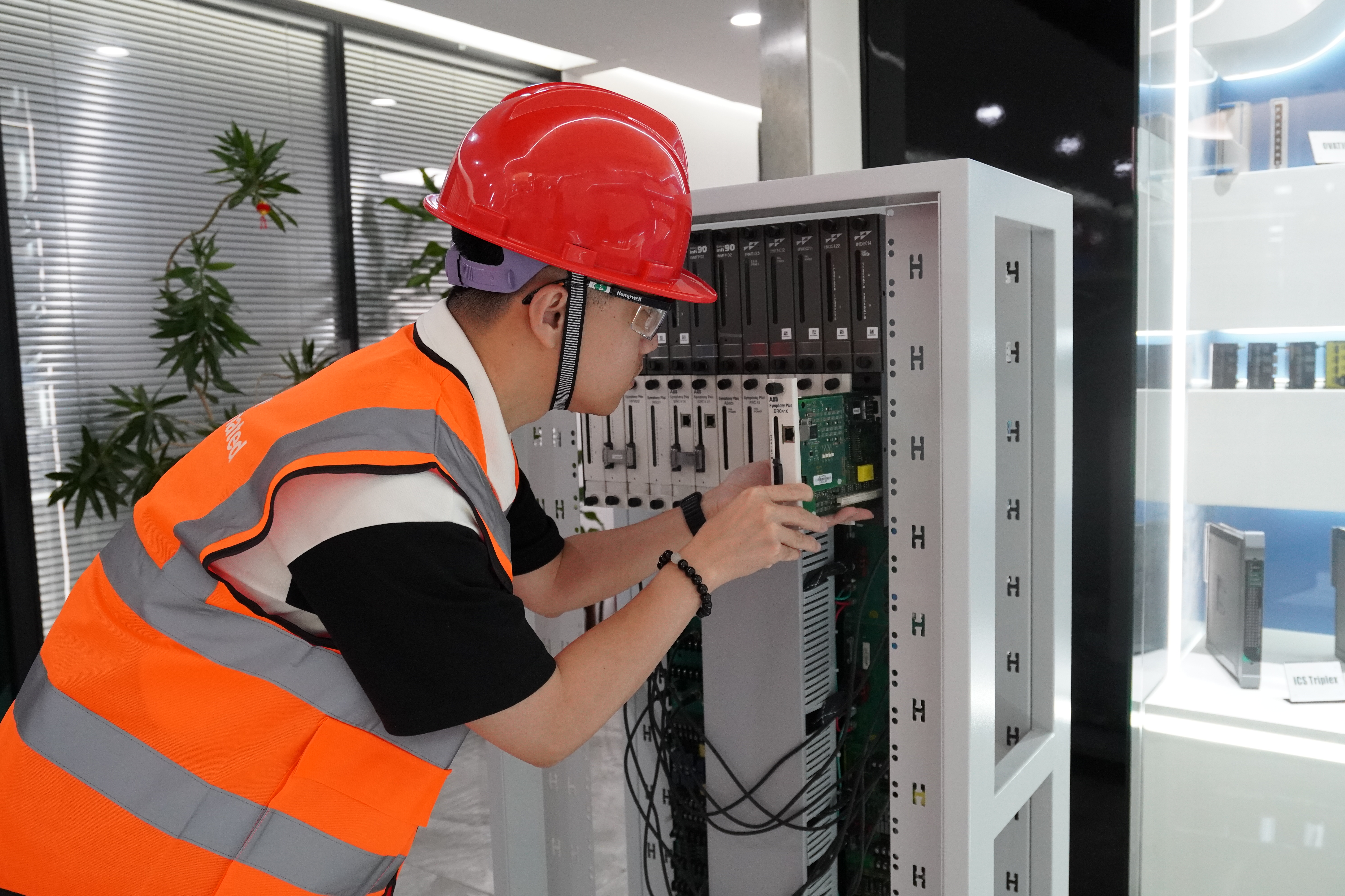 Industrial system verification Stockoems engineer verifying an industrial control system cabinet